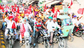 CPM activists carry out a rally on motorcycles in protest against the UPA government over price rise in Amritsar on Friday.
