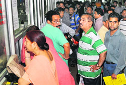 People wait for their turn at the RLA office, Sector 17, in Chandigarh on Friday. 