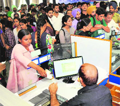 Heavy rush at the SBI fee counter at Panjab University on Friday.