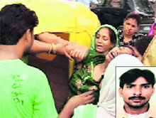 Poonam, the inconsolable wife of Pradeep (right), who hanged himself at Kajheri on Friday.