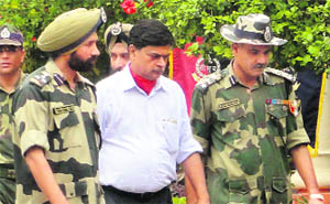 Senior BSF officers escort Union Home Secretary RK Singh during his visit to the RS Pura sector in Jammu on Friday. 