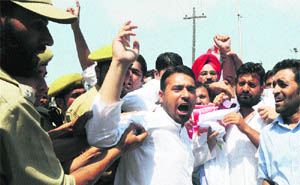 Policemen detain Youth Congress protesters in Srinagar on Friday. 