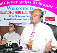 John Samuel, Chief Postmaster General, Jammu and Kashmir Circle, addresses mediapersons in Srinagar on Friday. 