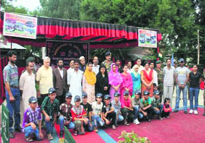 Students of Army Goodwill School, Bandipore, pose for a photograph before leaving for Noida. 
