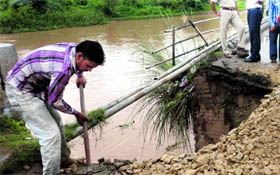 A labourer repairing the bridge.