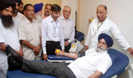 Sikandar Singh Maluka donates blood on Saturday. 