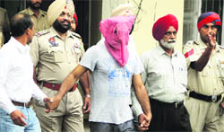 Raja Kandola being produced in a court in Jalandhar on Saturday.