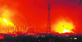 Balls of fire rise over the Amuay refinery near Punto Fijo on Saturday.