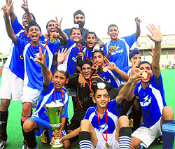 Players of the Chandigarh hockey team in a jubilant mood after winning the SN Vohra Tournament at Sector 42 in Chandigarh on Sunday