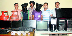 The accused with stolen goods in police study at the Mani Majra police station in Chandigarh on Sunday