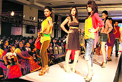 Models walk the ramp during the Dehradun fashion week on Sunday