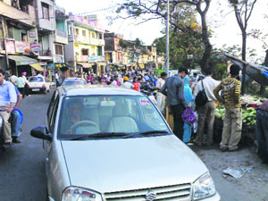 Encroachment on the national highway near the gurdwara road in Palampur.
