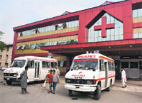 Ambulances wait for patients outside the Shri Maharaja Hari Singh (SMHS) Hospital in Srinagar. 