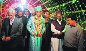 Relatives accompany a bridegroom during his wedding in Srinagar. 