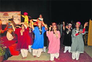 Girls perform a traditional Kashmiri dance at a function in Srinagar on Sunday.