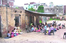 Students study in the open at a government school in Ludhiana