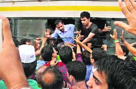 Arvind Kejriwal being taken away by the police in New Delhi on Sunday