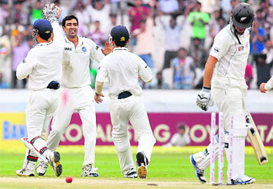 Ravichandran Ashwin celebrates the wicket of New Zealand captain Ross Taylor on the fourth day of the first Test in Hyderabad on Sunday. Ashwins match figures of 12/85 are the best against New Zealand by any Indian bowler.  