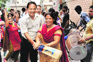 Kamal Passis proud parents join in the celebrations at Amritsar on Sunday. 