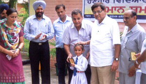 A student being honoured at the special high school in Bathinda.