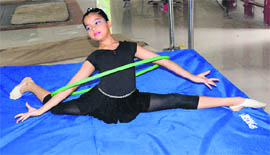 A participant performs at the Inter-school Rhythmic Gymnastics Tournament in Sector 7, Chandigarh on Monday.