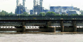 The ITO bridge is submerged after the Yamuna received water from the Hathnikund Barrage, in New Delhi on Monday.
