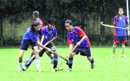 A match during the Dhyan Chand Memorial-Inter School Girls Hockey Tournament in Dehradun on Monday.