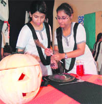 Girl students take part in the inter-house creativity competition at Summer Valley School in Dehradun on Monday. 