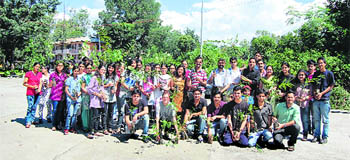 Students of the DRPGMC, Tanda, during a plantation drive on the college campus on Monday. 