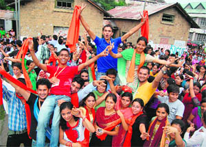 ABVP supporters celebrate the SCA election victory at the HPU Regional Centre in Dharamsala on Monday. 