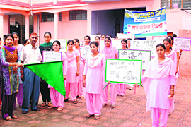 NSS voulnteers hold a raly to observe Sadbhawana Diwas at Ramgarh area of Samba district.