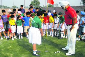 Students get tips on golf at the DPS, Khanna, where a golf course has been developed.