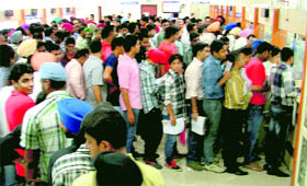 A huge rush at the counters of the Suvidha Centre in Ludhiana on Monday.