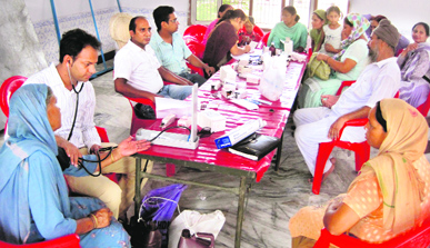 Patients being examined at a medical camp organized by the Health Department at Mudrapur Awana village in Hoshiarpur district.