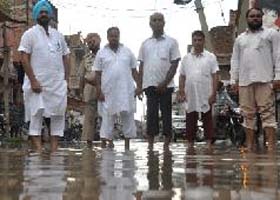 Ex-MLA Harminder Singh Jassi of the Congress takes stock of the situation in Paras Ram Nagar
