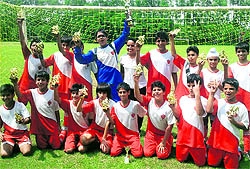 The soccer team of Strawberry Fields World School after winning the Brother Meredith Football Trophy at St Johns High School in Chandigarh on Tuesday