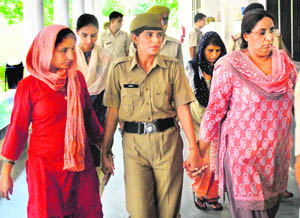 Rohtak Apna Ghar accused being produced in a court in Panchkula on Tuesday. 