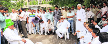 MLA Ram Pal Majra (standing) makes a point at the Jan Vidhan Sabha held by the INLD in Chandigarh on Tuesday.