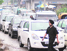 Heavy rains and poor condition of the road lead to traffic snarls near BMC Chowk in Jalandhar on Tuesday.