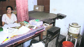 The damp roof of Maternity and Child Health Centre at Central Town in Jalandhar; and (below) housed in two rooms, the dispensary cramps for space.
