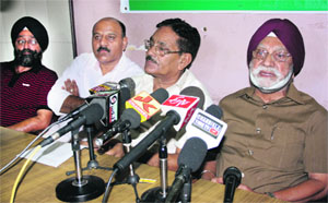 PDP spokesperson Rangil Singh addresses a press conference in Jammu on Tuesday.