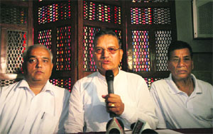 The president of the Jammu Yatri Bhawan Trust, Pawan Tiwari, addresses a press conference in Jammu on Tuesday.