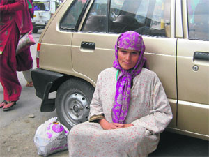 The hearing and speech impaired woman who has been wandering the streets of Kupwara for the past few days. Residents plan to help find her family by pasting posters on public vehicles.