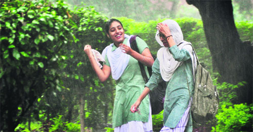 Schoolgirls brave showers in Ludhiana on Tuesday.