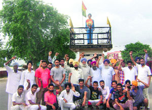 Residents of Sarabha village raise slogans in support of their demands.