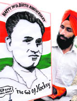 Paper artist Gurpreet Singh displays a portrait of hockey legend Dhyan Chand made from using 5,740 iron nails in Amritsar. 