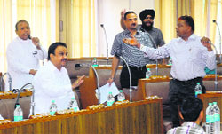 Councillors argue during a General House meeting of the Municipal Corporation in Chandigarh on Wednesday.