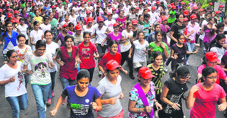 Students take part in a race at the Post Graduate Government College for Girls in Sector 42, Chandigarh, on Wednesday.