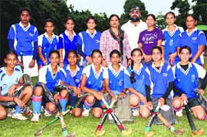 The MKP College team that won the Dhyan Chand Memorial Girls Open Hockey Tournament in Dehradun on Wednesday.
