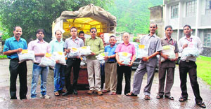 Staff members of PNB with relief material in Dehradun on Wednesday.